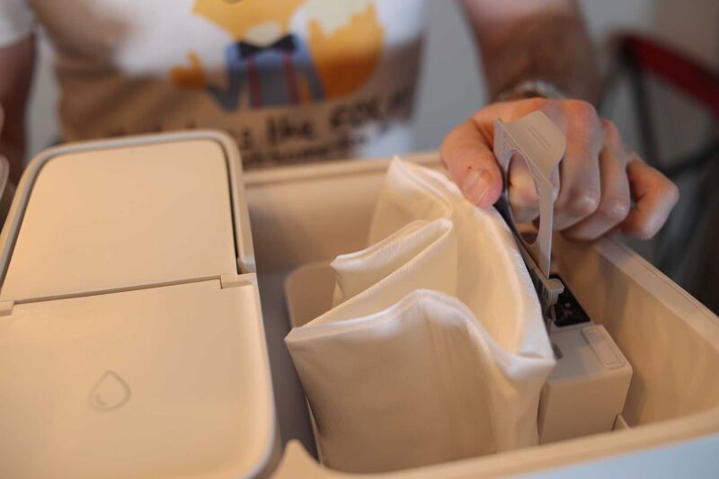 Removing the disposable dust bag from the Roborock S8 Pro’s ultra station.